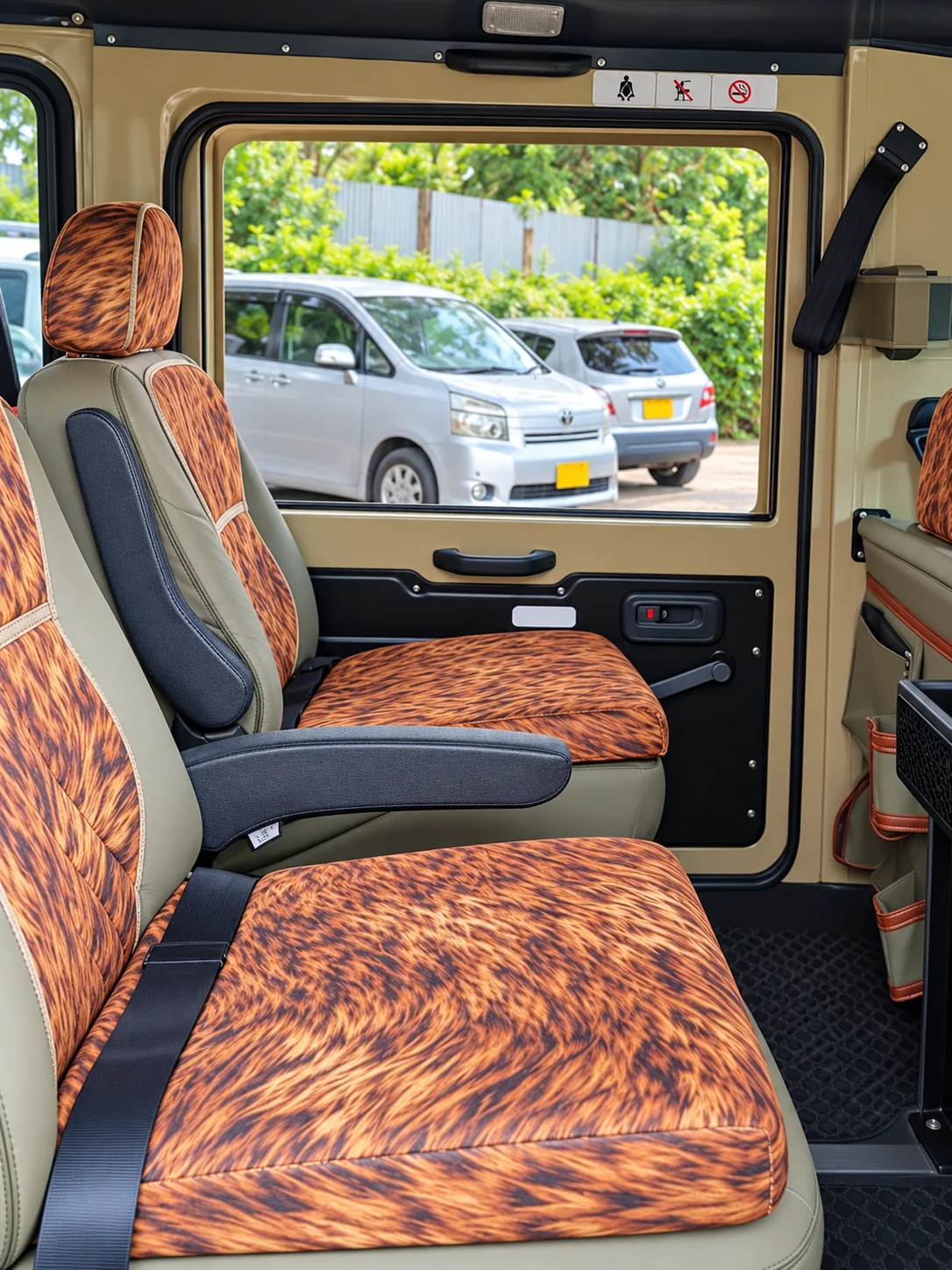Individual passenger seats with armrests and seat belts